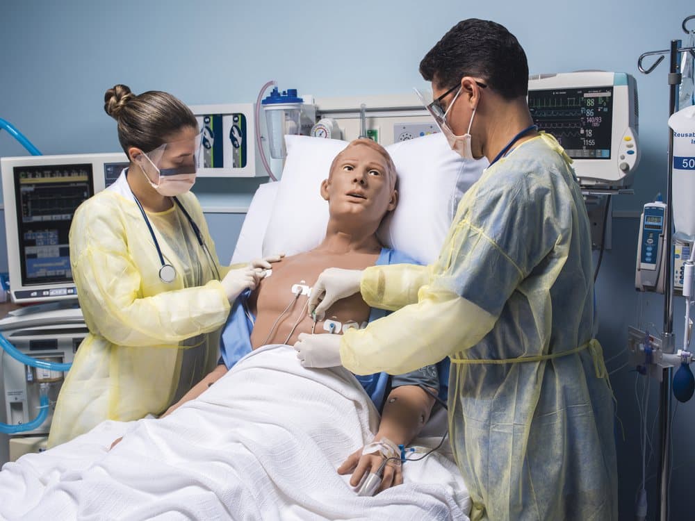 Clinical team performing a simulated delivery on a Gaumard patient simulator